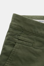 Close-up front view of the Jacob Cohen Bermudas 'Bob' green, slim fit, garment-dyed elasticated cotton shorts with French pockets and fine twill texture, showcasing the soft feel and button fly detail. Summer as it should be: The Bermudas 'Bob' by JACOB C