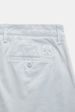 Close-up rear view of Jacob Cohen Bermudas 'Bob' pastel blue shorts showing slim fit, garment-dyed soft cotton with buttoned back pocket and leather patch. Summer as it should be: The Bermudas 'Bob' by JACOB COHEN combine a casual garment-dyed design with