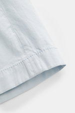 Close-up of the hem of Jacob Cohen Bermudas 'Bob' pastel blue shorts, showing soft, stretchy, garment-dyed cotton and fine twill texture.