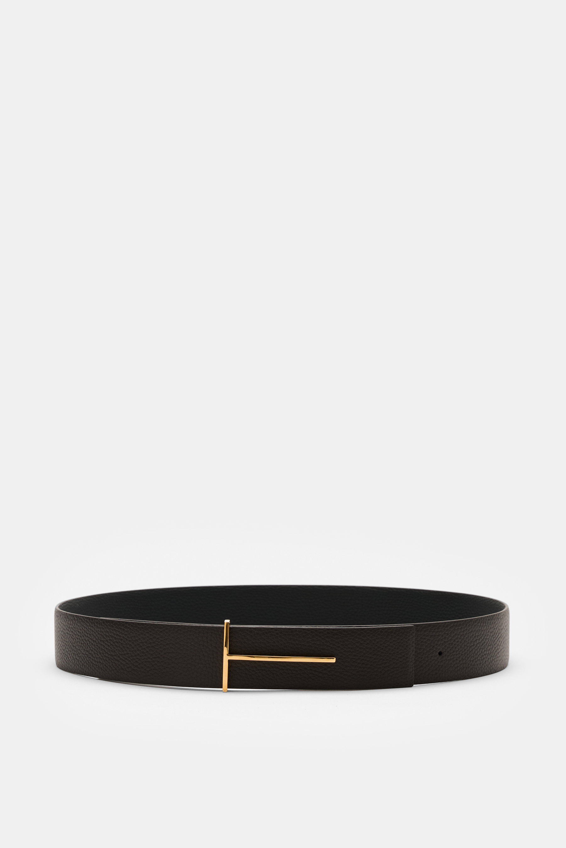 Tom Ford Gürtel schwarz/dunkelbraun aus edlem Kalbleder mit goldfarbener Dornschließe, charakteristischer Narbung, wendbar, frontal fotografiert, ca. 3,5 cm breit, Made in Italy.