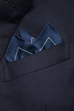 Tom Ford Silk pocket square grey-blue/white, with polka dots, pure silk, smooth feel, rolled edges, small TOM FORD print, made in Italy, approx. 39x39 cm, shown folded in a navy suit pocket from a close-up front angle.