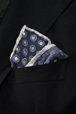 Close-up from above of a Brunello Cucinelli Silk Pocket Square navy/grey-blue dotted folded in a black jacket pocket, showing its dotted pattern and rolled edges.

<p>Subtle elegance for style-conscious appearances: With this finely dotted pocket square, 