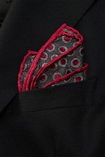 Close-up from above of a Brunello Cucinelli Silk Pocket Square dark grey/dark red dotted folded in a black jacket pocket.

Description: 
<p>Subtle elegance for style-conscious appearances: With this finely dotted pocket square, BRUNELLO CUCINELLI once aga