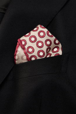 Close-up front view of a Brunello Cucinelli Silk Pocket Square beige/burgundy dotted in a black jacket pocket, showing its rolled edges and smooth silk texture.

<p>Subtle elegance for style-conscious appearances: With this finely dotted pocket square, BR