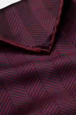 Brunello Cucinelli Silk Pocket Square burgundy patterned shown close-up from above, displaying tonal woven pattern and rolled edges. Subtle elegance for style-conscious appearances: With this noble pocket square in tonal woven pattern, BRUNELLO CUCINELLI 