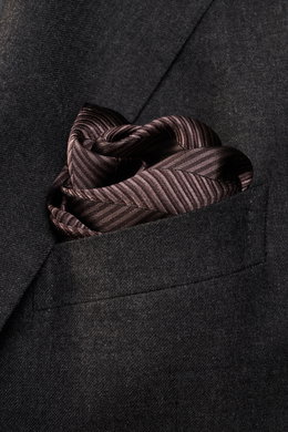 Close-up front view of Brunello Cucinelli Silk Pocket Square dark brown patterned in a suit pocket with tonal woven pattern and rolled edges.

<p>Subtle elegance for style-conscious appearances: With this noble pocket square in tonal woven pattern, BRUNEL
