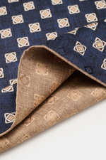 Brunello Cucinelli Silk Pocket Square navy/beige patterned shown close-up from an angled top view, highlighting ornamental pattern and rolled edges. 

<p>Elegant accent: The silk pocket square from BRUNELLO CUCINELLI with its distinctive ornamental patter
