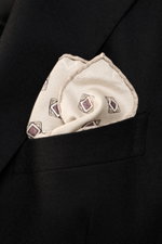 Close-up front view of Brunello Cucinelli Silk Pocket Square sand/beige patterned elegantly folded in a black blazer pocket.

Description: 
<p>Elegant accent: The silk pocket square from BRUNELLO CUCINELLI with its distinctive ornamental pattern is an eye