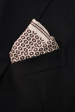 Brunello Cucinelli Silk pocket square dark brown/navy pattern shown from close-up front angle in black jacket pocket, pure silk, smooth feel, graphic micro print, rolled edges, Made in Italy, dimensions approx. 35 cm x 35 cm.