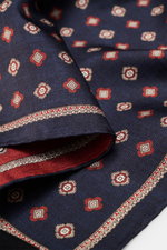 Close-up angled view of Brunello Cucinelli Silk pocket square navy/reddish brown patterned, featuring a subtle medallion design and rolled edges.

Additional description: 
<p>Noble accent: The silk pocket square by BRUNELLO CUCINELLI features a subtle med