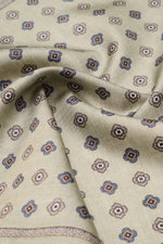 Brunello Cucinelli Silk pocket square sage/sand patterned, close-up front view showing pure silk with smooth feel, medallion pattern, and rolled edges. Noble accent: The silk pocket square by BRUNELLO CUCINELLI features a subtle medallion pattern that add