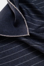 Close-up top view of the Brunello Cucinelli Silk pocket square navy/grey striped, showcasing its pure silk fabric with smooth feel, classic striped pattern, rolled edges, approx. 35 cm x 35 cm, made in Italy.

Description:
<p>Timeless refinement for sophi