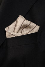 Brunello Cucinelli Silk pocket square beige/dark brown striped in black blazer pocket, close-up front view, smooth pure silk, rolled edges.