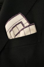 Close-up from above of Brunello Cucinelli Silk pocket square sand/dark violet striped folded in a black blazer pocket.

Additional description:  
<p>Timeless refinement for sophisticated looks: The silk pocket square by BRUNELLO CUCINELLI features an eleg