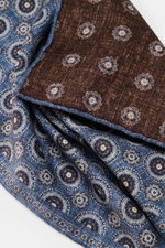 Close-up front view of the Brunello Cucinelli Silk Pocket Square grey blue/brown patterned, showing pure silk fabric with a smooth feel, subtle medallion pattern, and rolled edges.

<p>Noble accent: The silk pocket square by BRUNELLO CUCINELLI features a 