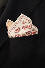 Alt tag (124 characters): Close-up front view of Brunello Cucinelli Silk Pocket Square beige/dark red patterned in a black blazer pocket with medallion print.

Description: 
<p>Noble accent: The silk pocket square by BRUNELLO CUCINELLI features a subtle m