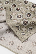 Close-up top-down view of the Brunello Cucinelli Silk Pocket Square grey sage/light grey patterned, showing a subtle medallion design.

<p>Noble accent: The silk pocket square by BRUNELLO CUCINELLI features a subtle medallion pattern that adds a discreet 