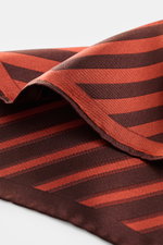 Close-up angled view of the Brunello Cucinelli Silk Pocket Square grey brown/brown striped showing smooth pure silk fabric with diagonal stripes and rolled edges.

Description:  
<p>Subtle elegance for stylish appearances: With this noble pocket square