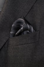 Brunello Cucinelli Silk Pocket Square grey brown/brown striped in diagonal stripes, smooth pure silk with rolled edges, angled close-up view.