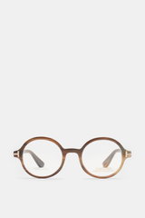 Front view of Tom Ford Horn glasses 'Private Collection' brown patterned with round design, genuine buffalo horn frame, plastic demo lenses, and T-shaped details.