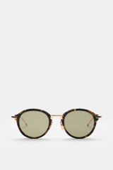 Thom Browne Sonnenbrille dunkelbraun/gold gemustert, rund, Schildpatt-Acetat, Metallbügel mit Tricolore, frontale Nahaufnahme, getönte Gläser, 100% UV-Schutz.