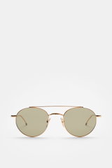 Thom Browne Sonnenbrille gold, runde Form mit filigranem Metallrahmen, Tricolore-Detail am Bügel, getönte Gläser, Frontansicht, 100% UV-Schutz.