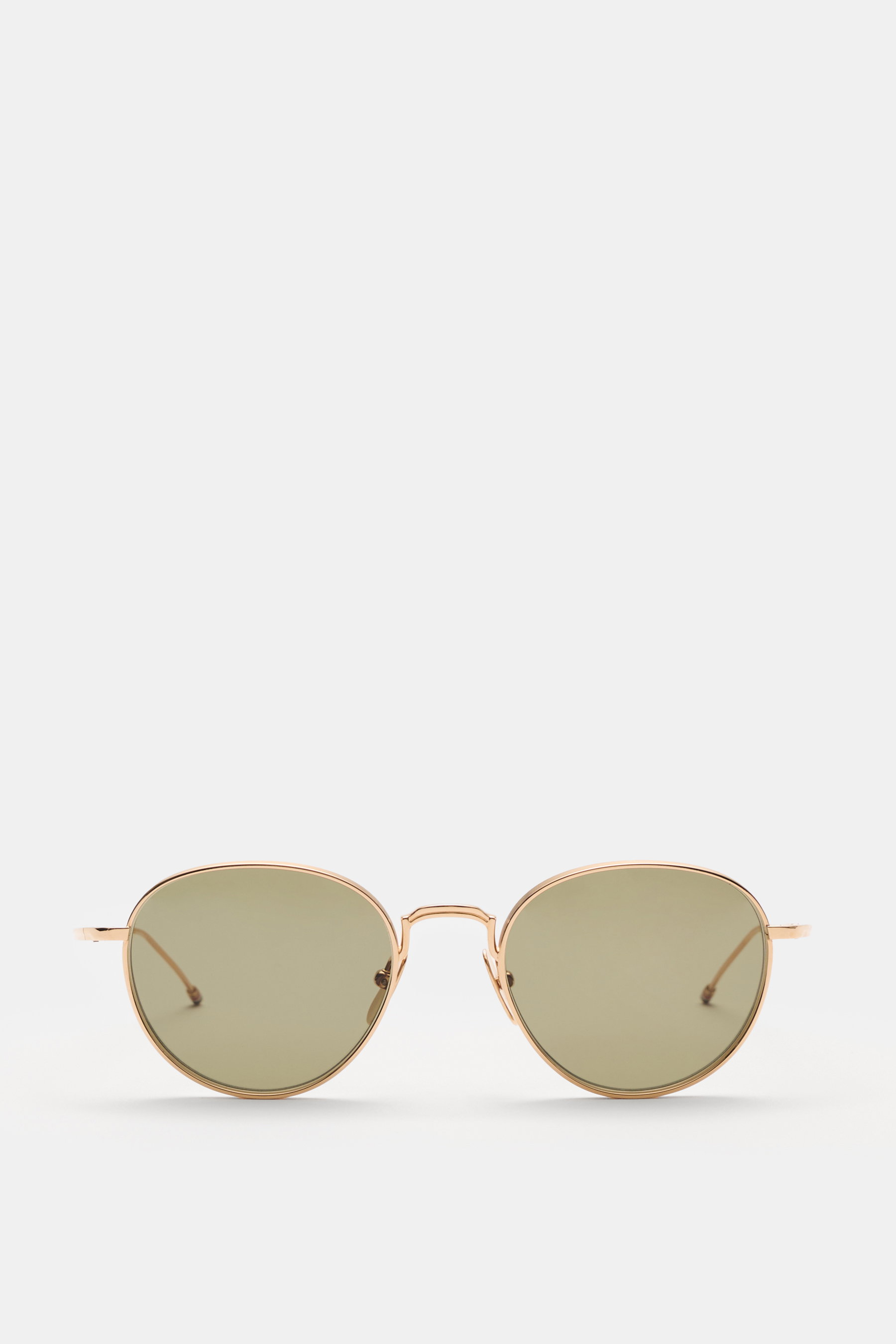 Thom Browne Sonnenbrille gold, frontale Ansicht, runde Form, tiefer Metallrahmen, gleichmäßig getönte Gläser, Tricolore-Detail am Bügel, 100% UV-Schutz.