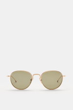 Thom Browne Sonnenbrille gold, frontale Ansicht, runde Form, tiefer Metallrahmen, gleichmäßig getönte Gläser, Tricolore-Detail am Bügel, 100% UV-Schutz.
