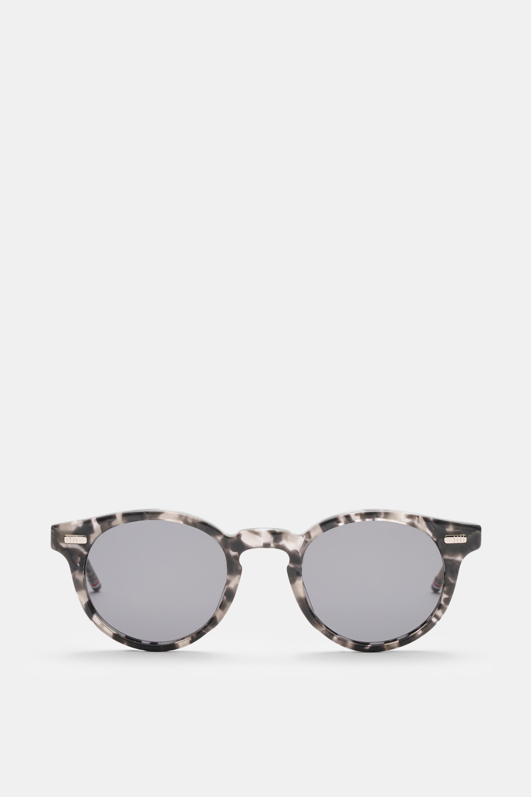 Front view of Thom Browne Sunglasses grey with tortoise acetate frame and evenly tinted grey lenses, classic notched bridge shape.

Description: <p>Their classic and elegant notched bridge shape and acetate frame give these sunglasses by THOM BROWNE a par