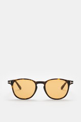 Tom Ford Sonnenbrille 'Holt' dunkelbraun meliert/gelb, frontale Nahaufnahme, leicht gerundete Silhouette, melierte Acetat-Fassung, gelbe Kunststoffgläser, UV-Schutz.