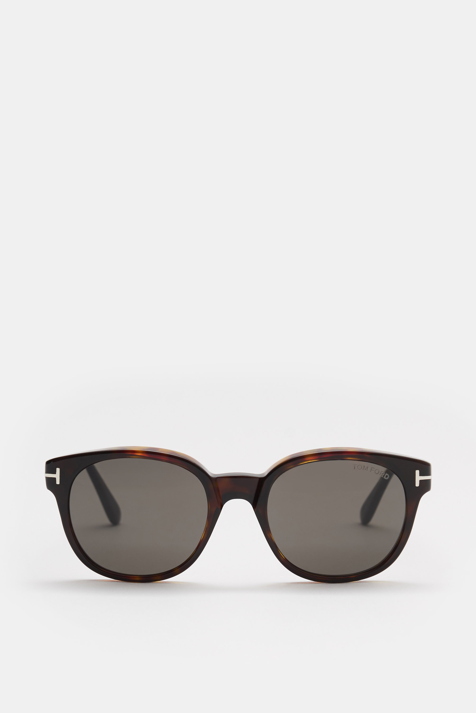 Tom Ford Sonnenbrille 'Mert' dunkelbraun meliert, frontale Nahaufnahme, leicht gerundete Silhouette, melierter Acetat-Rahmen, getönte Kunststoffgläser, UV-Schutz.