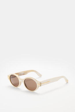 Tom Ford Horn-Sonnenbrille 'Private Collection' offwhite/creme gemustert, runder Retro-Look, Büffelhorn, seitliche Ansicht mit braunen Gläsern, 'T'-Detail.