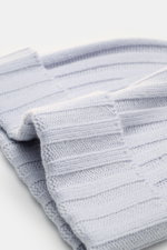 Close-up side view of the soft light blue von Braun Cashmere beanie showing fine rib knit, small turn-up, and pure Mongolian cashmere texture.