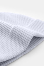 Close-up side view of the light blue von Braun Cashmere beanie showing its fine rib knit pattern and small turn-up cuff, made of pure Mongolian cashmere, very soft feel, perfect with winter coats or down jackets.