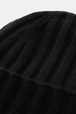 Close-up angled view of the von Braun Cashmere beanie black showing its fine rib knit pattern and soft pure Mongolian cashmere texture. Whether worn with a classic winter coat or a highly functional down jacket, this soft VON BRAUN knitted beanie made of 