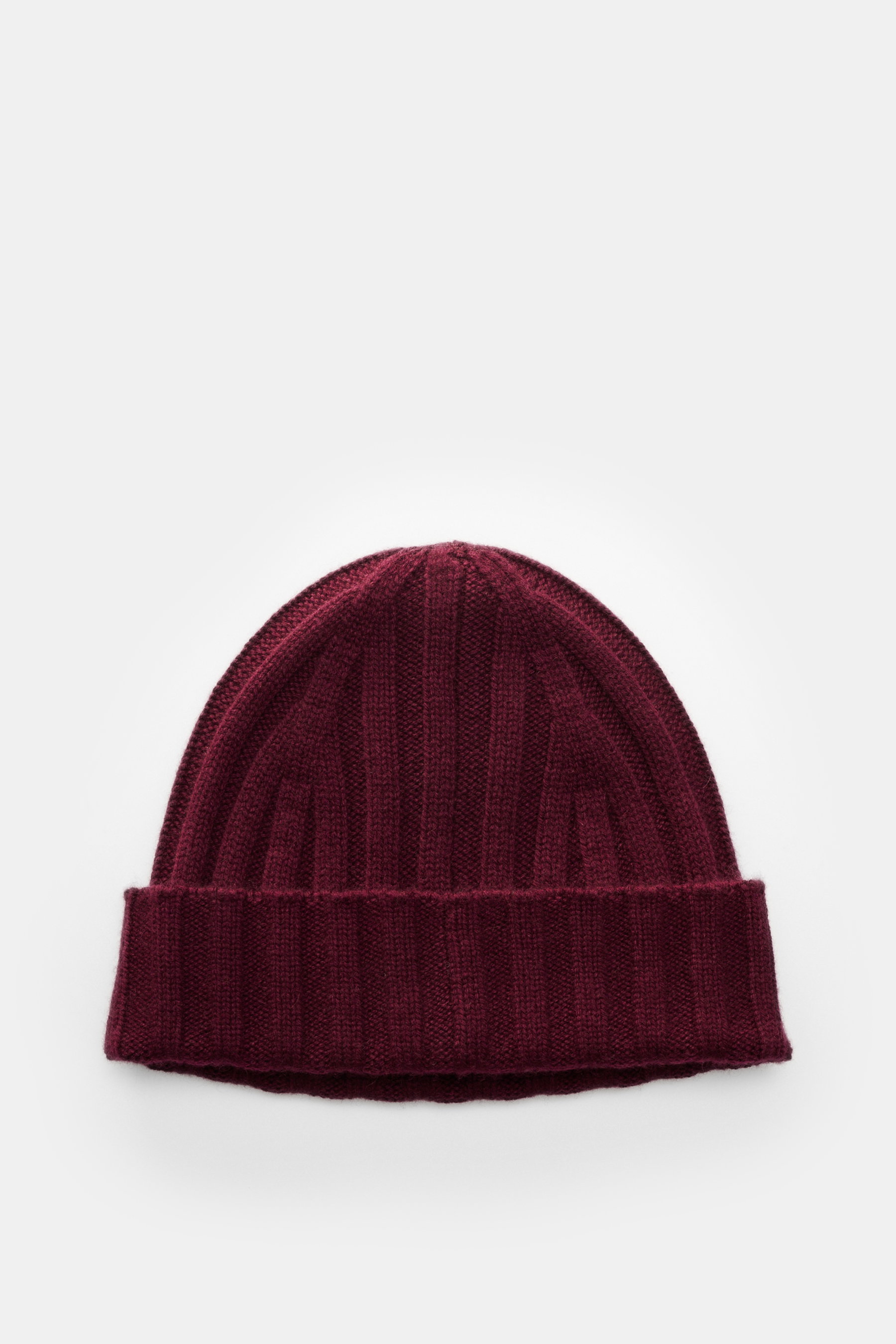 von Braun Cashmere beanie burgundy shown from above, featuring pure cashmere, very soft feel, fine classic rib knit pattern, and small turn-up cuff. Whether worn with a classic winter coat or a functional down jacket, this soft VON BRAUN knitted beanie ma