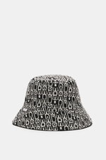 04651/ A trip in a bag Wende-Frottee Bucket Hat schwarz, schwarz-weiß gemustert, schmale Krempe, weiche Baumwolle, wendbar, seitlich Weblabel, Frontansicht.