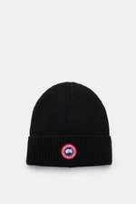 Top-down view of a black Canada Goose Wool beanie with chunky pure wool rib knit, robust fabric, and a fold-up cuff featuring a red and white woven label.

Description: 
<p>A must-have for the colder months: Don’t let bad hair days or cold winter days get