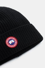 Close-up front-side view of Canada Goose Wool beanie black showing chunky rib knit pure wool fabric with turn-up and red circular woven label.

Description: <p>A must-have for the colder months: Don’t let bad hair days or cold winter days get to you with 