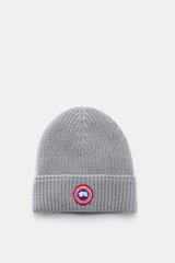 Canada Goose Wool beanie light grey shown from above, featuring chunky rib knit pure wool fabric, robust texture, and a folded turn-up with a red Canada Goose woven label. A must-have for colder months: Don’t let bad hair days or cold winter days get to y
