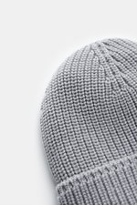 Canada Goose Wool beanie light grey shown from the top-down perspective, featuring chunky rib knit, pure wool, robust fabric, and turn-up with woven label. A must-have for colder months: don’t let bad hair days or cold winter days get to you with this bea