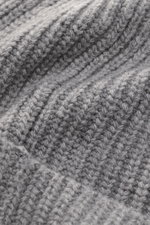Close-up shot of the Stone Island Wool Beanie grey showing its modern ribbed knit look and soft pure wool texture from an angled perspective.

<p>Minimalist winter essential: The wool beanie from STONE ISLAND combines functional comfort with urban style a