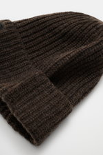 Close-up front-side view of Stone Island Wool Beanie grey brown showing pure wool, soft touch, ribbed knit, wide cuff, and front woven label.