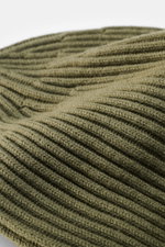 Close-up perspective of the Stone Island Wool Beanie Gray Green showing its modern ribbed knit look with wide cuff, soft pure wool texture.

<p>Minimalist winter essential: The wool beanie by STONE ISLAND combines functional comfort with urban style and t