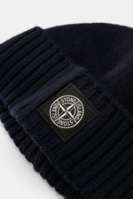 Stone Island Wool beanie navy viewed close-up from the side, featuring pure new wool, soft feel, wide ribbed cuff, front with STONE ISLAND woven label.