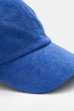 Close-up front angle of the 04651/ A trip in a bag Terry baseball cap 'Terry' blue in soft cotton terry fabric with six-panel style and adjustable closure.