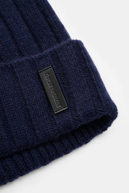 Close-up image from a top-side angle of the Emporio Armani Beanie dark blue showing wide rib knit, fine knit pattern, wide cuff, soft touch, mix of wool and cashmere, and leather logo patch.