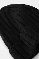 Close-up top-down view of Emporio Armani Beanie Black, showing mix of wool and cashmere, soft touch, fine knit pattern, wide rib knit, wide cuff, and leather logo patch.
