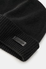Close-up view of the Emporio Armani Cap black, showing the narrow cuff with a leather logo patch, fine knit pattern, and soft touch mix of cashmere and microfiber.