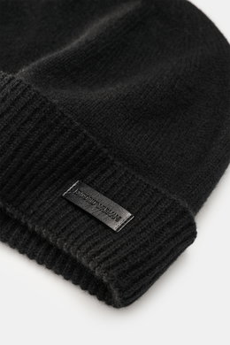 Close-up view of the Emporio Armani Cap black, showing the narrow cuff with a leather logo patch, fine knit pattern, and soft touch mix of cashmere and microfiber.